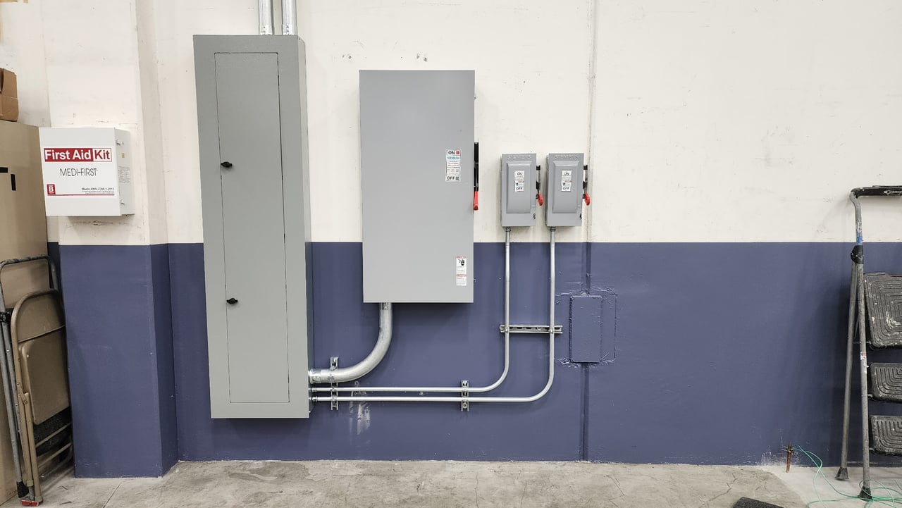 Distribution panel, disconnect switches and conduit for Marvin Engineering Group’s robotic paint booth power installation