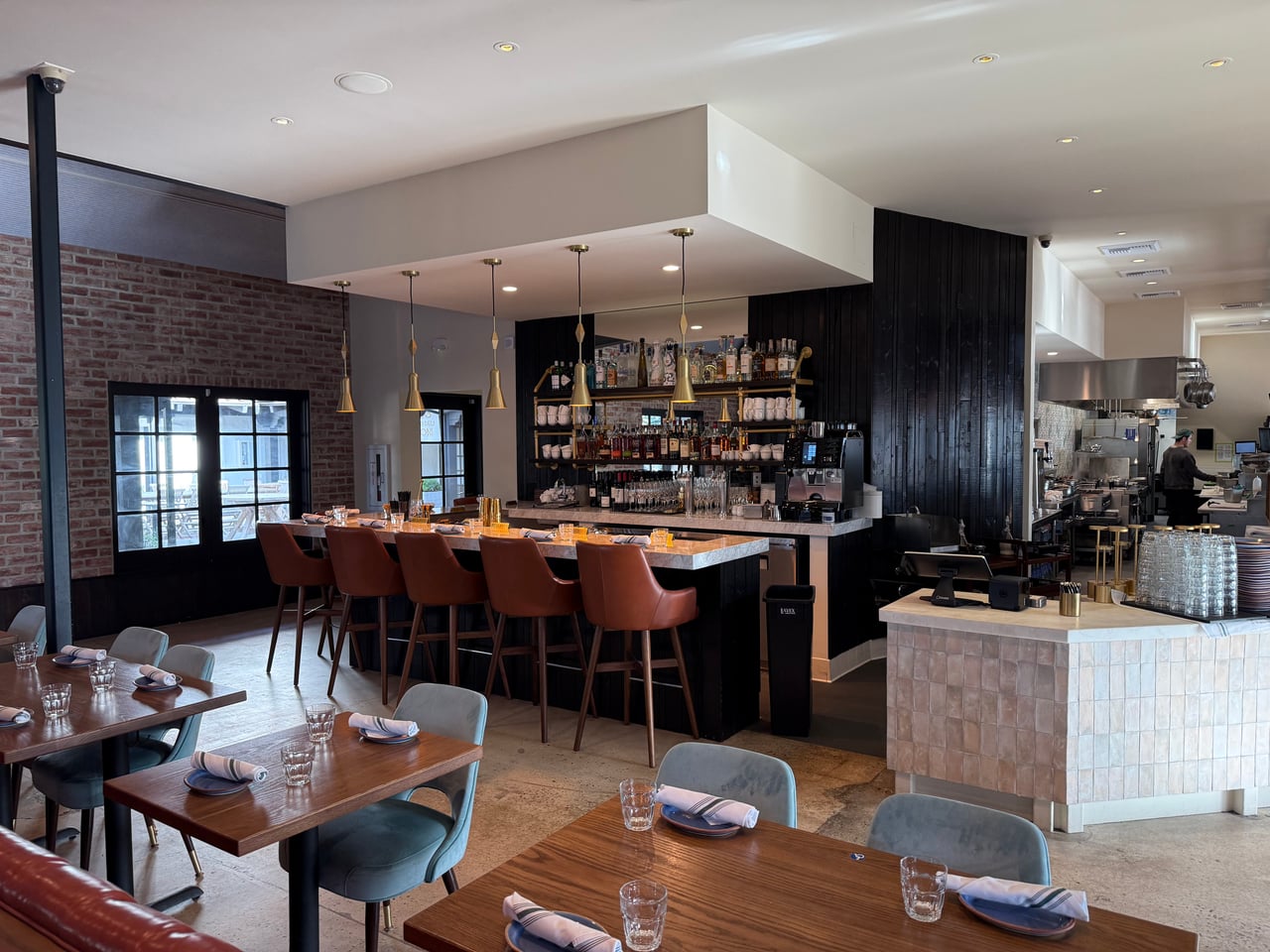 Brass pendants over the marble bar with recessed ceiling lights at OSPI