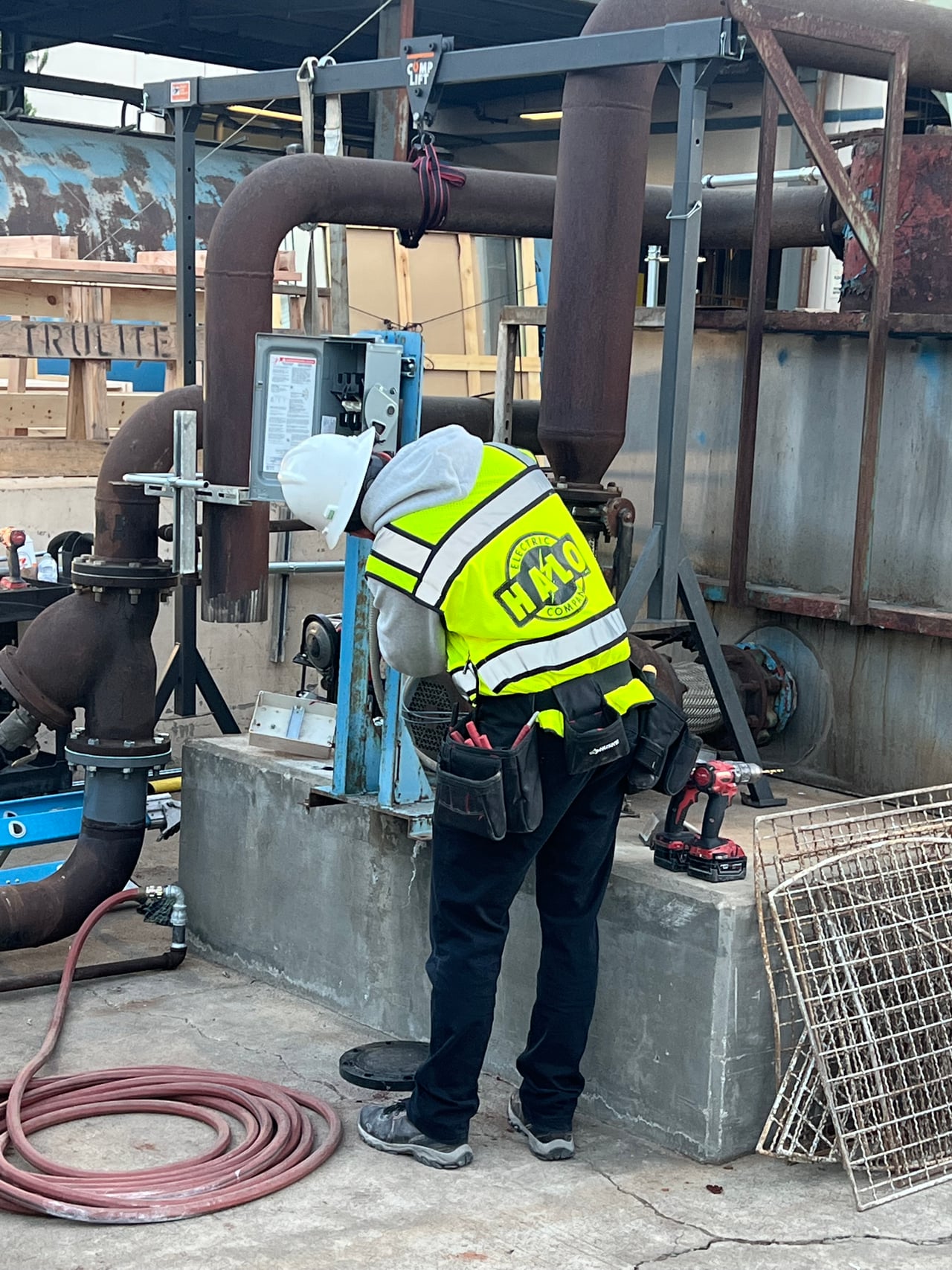 Halo Electric technician working on electrical equipment during the Trulite cooling tower retrofit